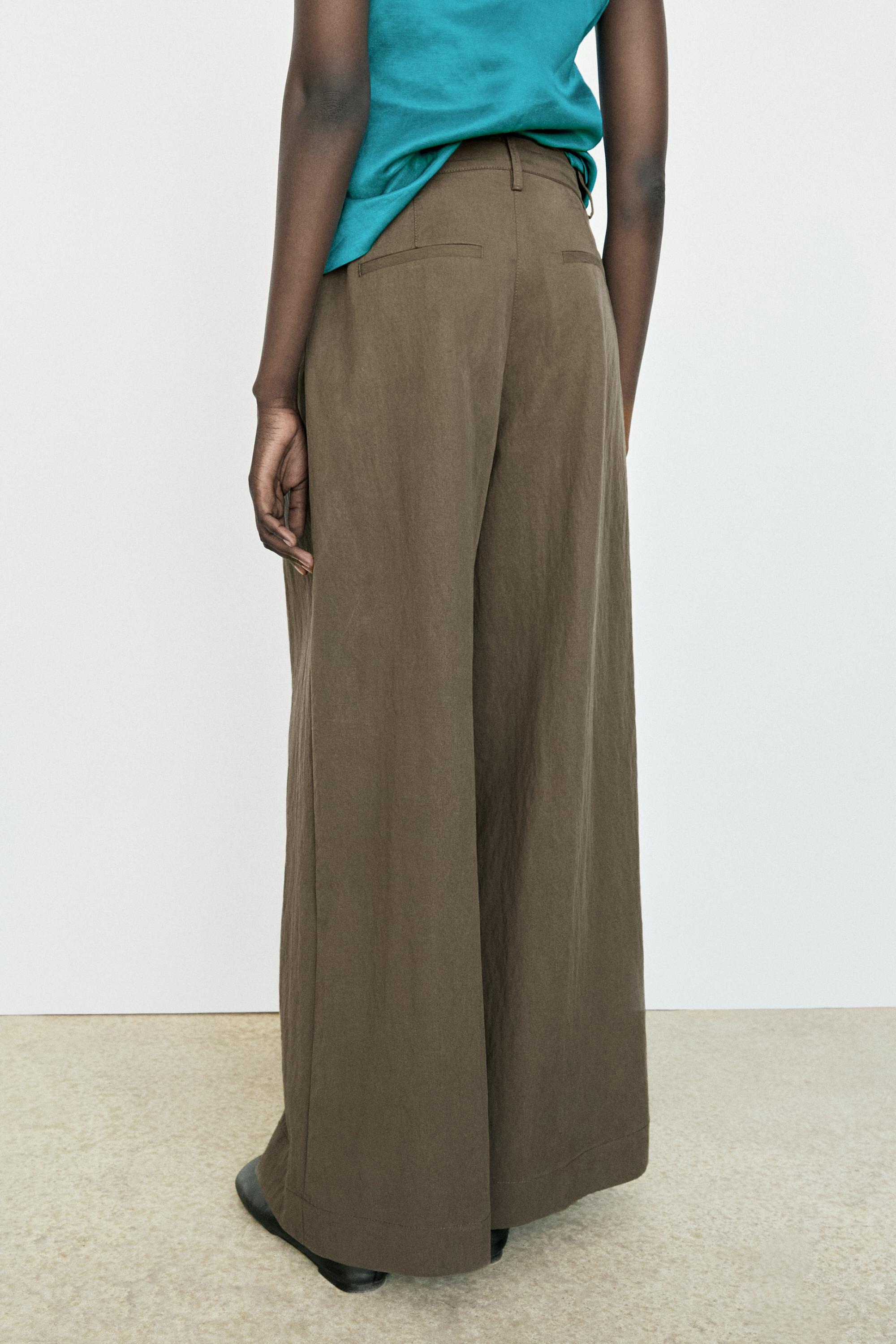 Technical wide-leg pleated pants